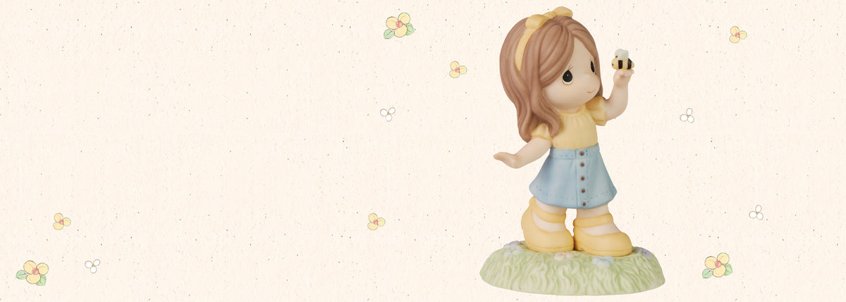 Precious Moments Girl with Bee figurine
