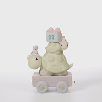 Two turtles wearing party hats, present on back with age 11 on it - 360 video
