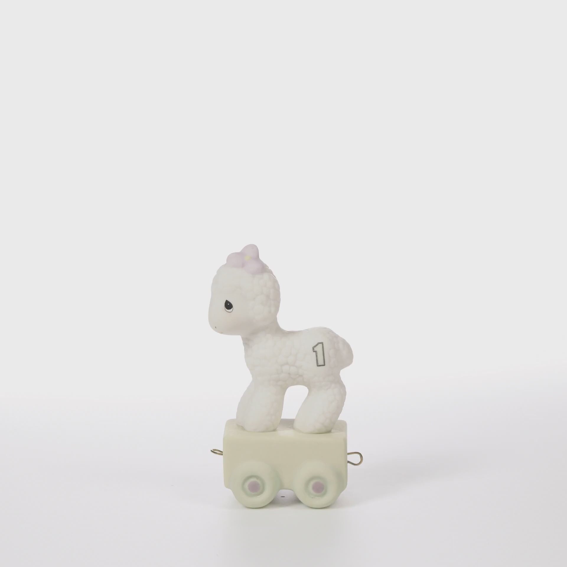 White lamb with age 1 on side standing on platform - 360 video