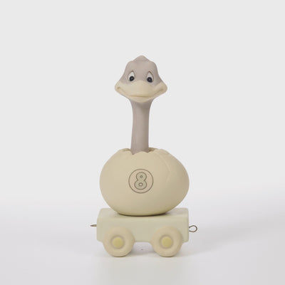 Ostrich popping out of egg on platform with age 8 on the side of shell - 360 video