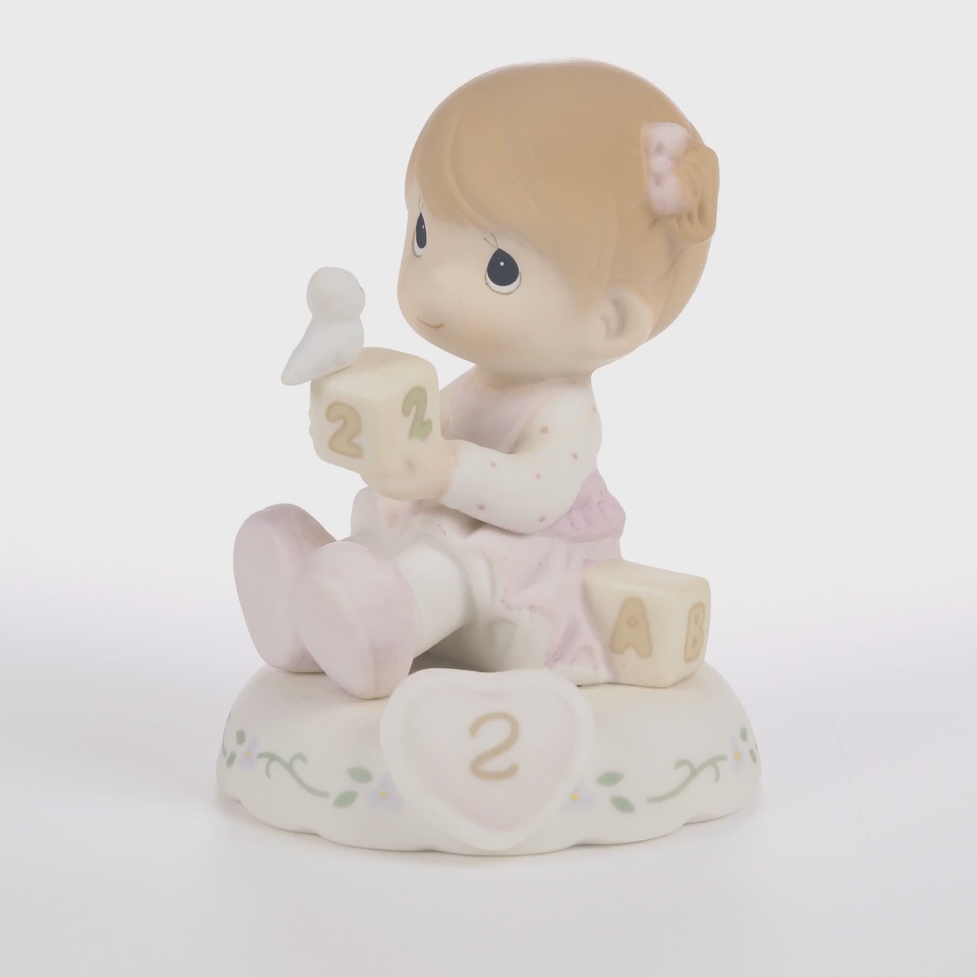 Redhead haired girl holding blocks with blue bird age 2 shown on base - 360 video