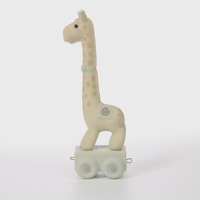Giraffe with blanket featuring age 6 on side standing on platform - 360 video